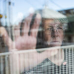 woman with alzheimers and diabetes looking out the window