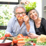 Happy couple cooking in the kitchen