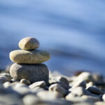 meditation stones against ocean background