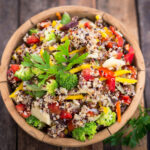 fresh quinoa salad in wooden bowl