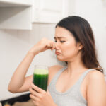 Woman does not like drinking health shake