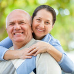 Smiling mature couple outside