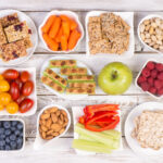 Variety of snacks on wooden table