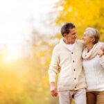 couple walks outside in autumn