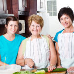 Three generations cooking together at home