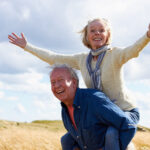 Man giving wife piggyback ride