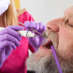 Man having his teeth examined