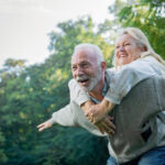 Happy senior couple having fun together outside