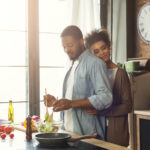 Loving couple happy cooking together at home