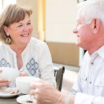 Happy senior couple drinking coffee together