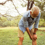 Man suffering from knee joint inflammation and pain