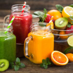 Glass jars filled with fruit juices