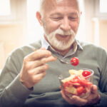 Man enjoying bowl of veggies