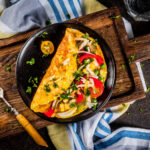 Healthy omelet in a cast iron skillet