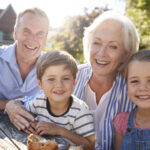 Grandparents enjoying the outdoors with their grandchildren